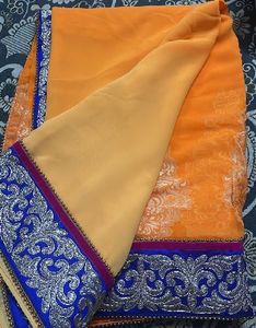 Vibrant Orange Saree with Silver Embroidery