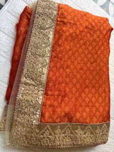 Elegant Orange Saree with Embellished Border