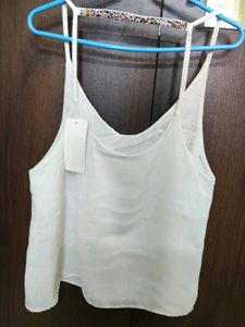 White camisole with beaded detail