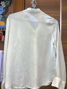 Elegant Cream Top with Metal Detail