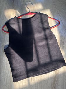 Pair Of White And Black Tank Tops
