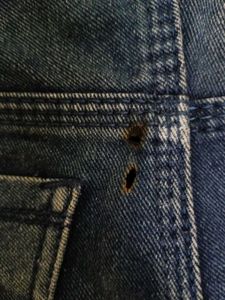 men's heavily distressed / ripped blue denim jeans