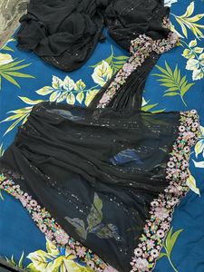Elegant Black Saree with Floral Blouse
