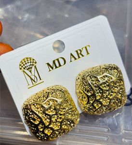Gold Tone Textured Square Earrings