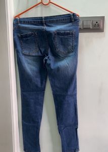 Distressed Blue Denim Jeans