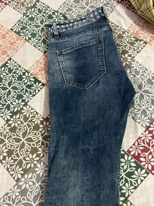 Distressed Blue Denim Jeans