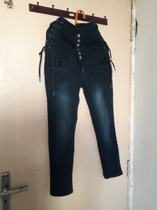 Stylish High-Waisted Jeans with Unique Details