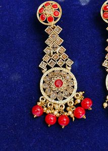 Gold Tone Dangle Earrings with Red Stones