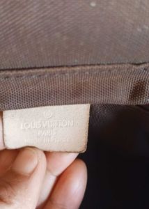 LV sling bag in mint condition, without code.