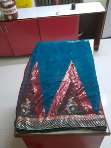 Party Wear Saree.Belive Me Its Too Preety, I Dont Wear Sarees So M Selling.Beautiful Sequence Pattern.colour Is Dark Green ,not Blue