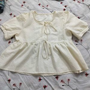 Cream Textured Peplum Top