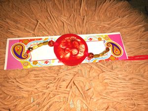 Resin Rakhi with Pearl Beads