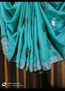 Elegant Teal Saree with Embellished Blouse