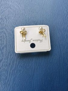 Pearl Bow Stud Earrings