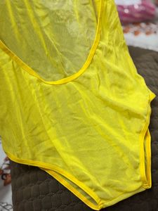 Yellow one-piece swimsuit with a deep scoop back