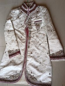 Heavy handwork ivory sherwani, for wedding functions..