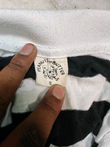 Women's black and white striped polo tee