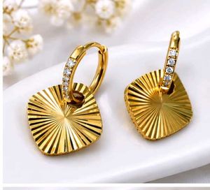 Gold Sunburst Dangle Earrings