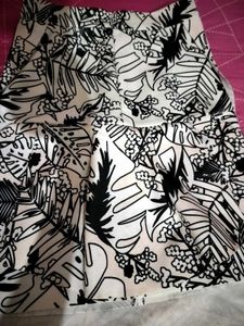 It is characterized by its bold black and white tr