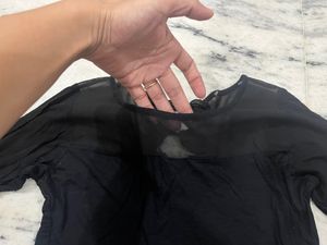 Black Top With A Net Neckline