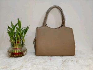 Elegant Beige Handbag with Silver Accent