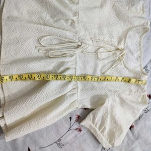 Cream Textured Peplum Top