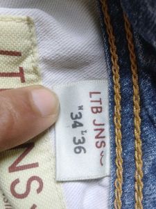 Distressed Blue Denim Jeans