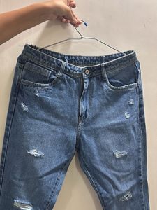 Distressed Blue Denim Jeans