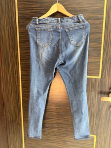 Distressed Blue Denim Jeans
