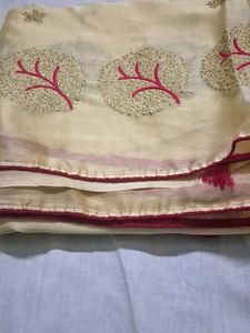 cream color embroidery saree