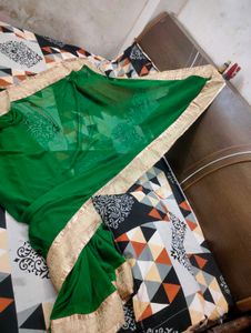 Elegant Emerald Green Saree with Gold Border