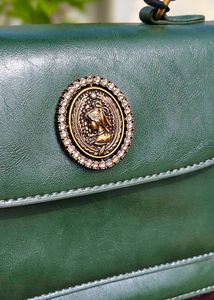 Chic Green Handbag with Gold Accent