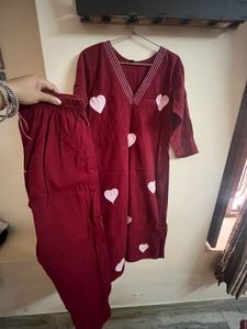 a deep marron colour kurta set