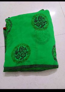 Vibrant Green Saree with Black Floral Motifs