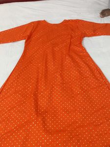 Vibrant Orange Kurti with White Polka Dots