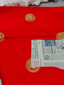 Elegant orange Saree with Gold Embellishments