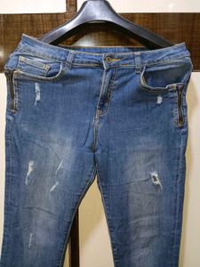 Ripped Blue Denim Jeans