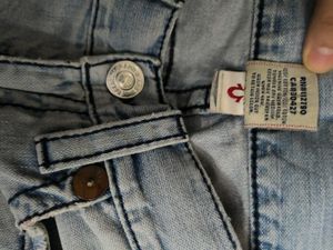Light Wash Distressed Denim Jeans