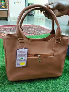 Elegant Brown Handbag with Floral Accents