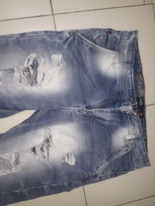 Distressed Blue Denim Jeans