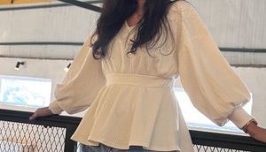 Cream Textured Peplum Top