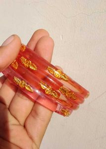 Elegant Red Bangles with Gold Accents