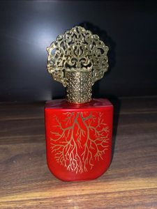 Unique Red Perfume Bottle with Ornate Cap