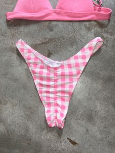 tri-bralette style bikini top and pink bot