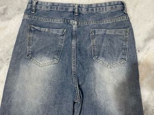 Distressed Wide Leg Jeans with Fringed Hem