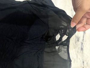 Black Top With A Net Neckline