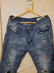 2 numbers of Distressed Blue Jeans