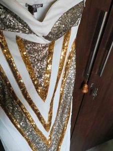 Cleopatra off-shoulder dress.
