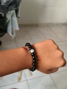 Black Beaded Bracelet with Blue Heart Charm