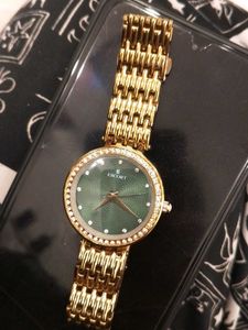 Elegant Gold Watch with Green Dial